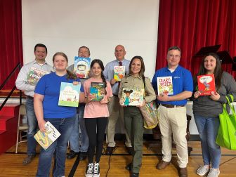 Grade school students holding up books for Allegany County Public Schools Read Across America